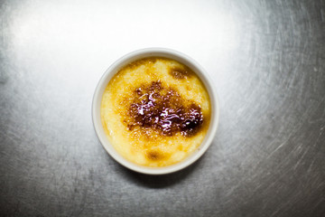 top view on ice-cream pan with creme brulee, standing on a steel tabletop