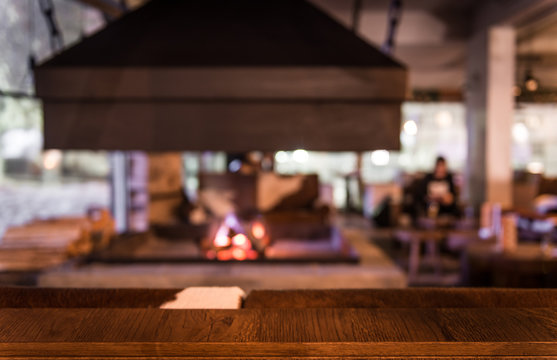 Blurred scene of restaurant interior with fireplace