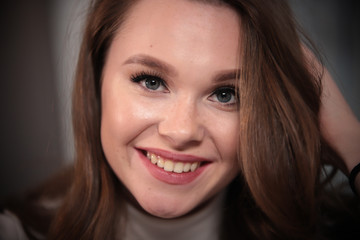 Portrait of young beautiful smiling woman . Close up