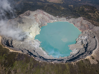 Aerial shot of the Mount Ijen volcano and emerald sulfur lake in Java, Indonesia