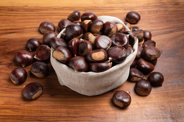 Fototapeta premium chestnuts in linen sack