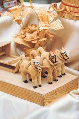Toy souvenir horses with wood sleds