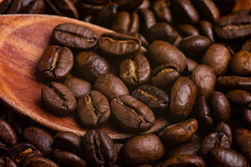 wooden spoon in coffee beans