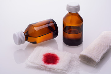 gauze napkin in the blood and two vials with hydrogen peroxide