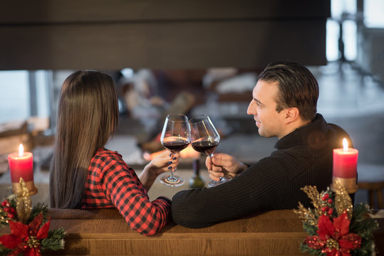Loving young couple enjoying spend time together drinking wine