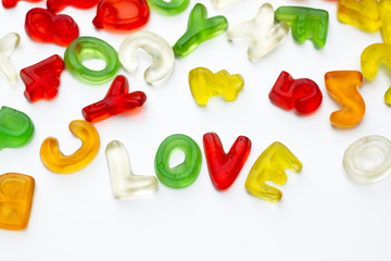 Title made from gummy letters of latin alphabet on white background