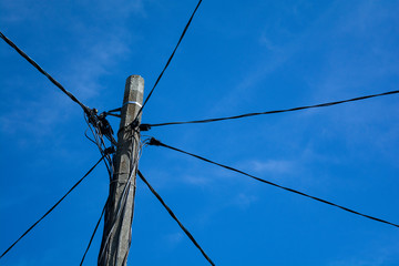pole with wires on the sky background