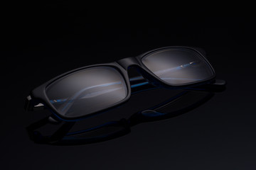 spectacles on a black background