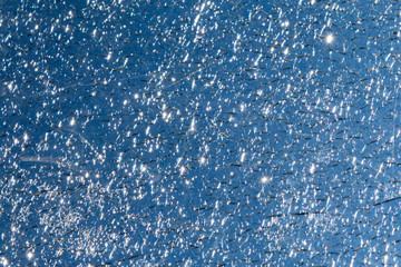 cracks in the glass on the sky background