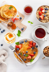 pancakes with blueberry strawberry honey and quinoa for breakfast © Olga Miltsova