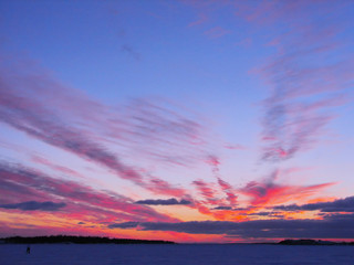 Winter sunset over frozen Baltic Sea in Finland