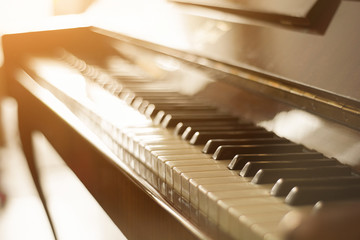soft focus. lonely piano on the window background