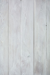 Textured pine boards covered with gray paint are arranged vertically. background concept