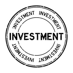 Grunge black investment word round rubber seal stamp on white background