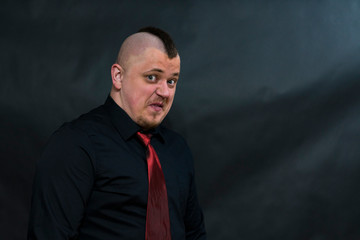 Subculture punk. Iroquois. Red tie. The look is directed to the lens. On the face an expression of...