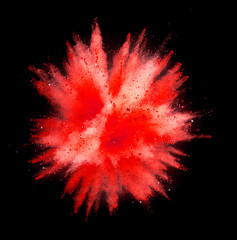 Colored powder explosion on black background