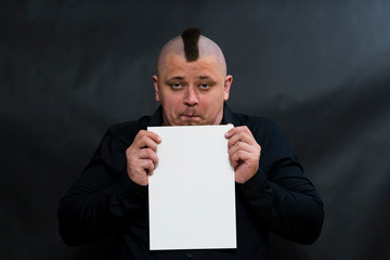 Iroquois. Looking into the lens. On the face reflected indifference. In hands is a clean white...