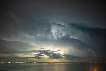 Stoff pro Meter Thunderstorm over the sea, lightning beats the water © A_Skorobogatova