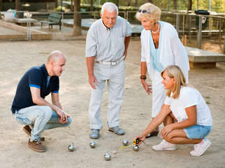 Happy family playing petanque in outdoor