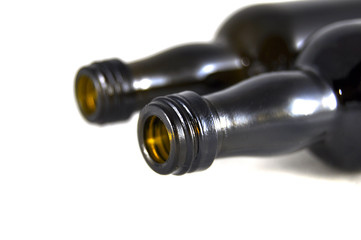 Wine bottles on white background close-up  