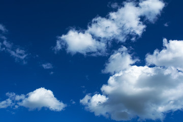 Naklejka na ściany i meble cumulus clouds against the blue sky