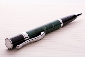 Fototapeta premium pen on a notebook