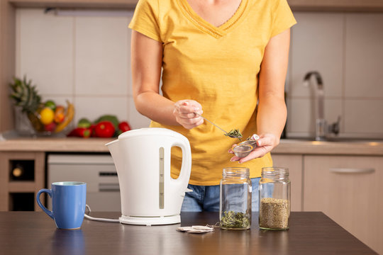 Woman Making A Mint Leaves Tea