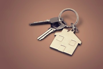 House keys with house figure  on background