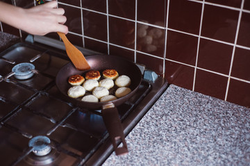 Frying pancake curd in a frying pan