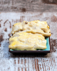 Cannelloni surrounded by rustic background