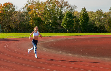 Healthy lifestyle young fitness woman running at outside