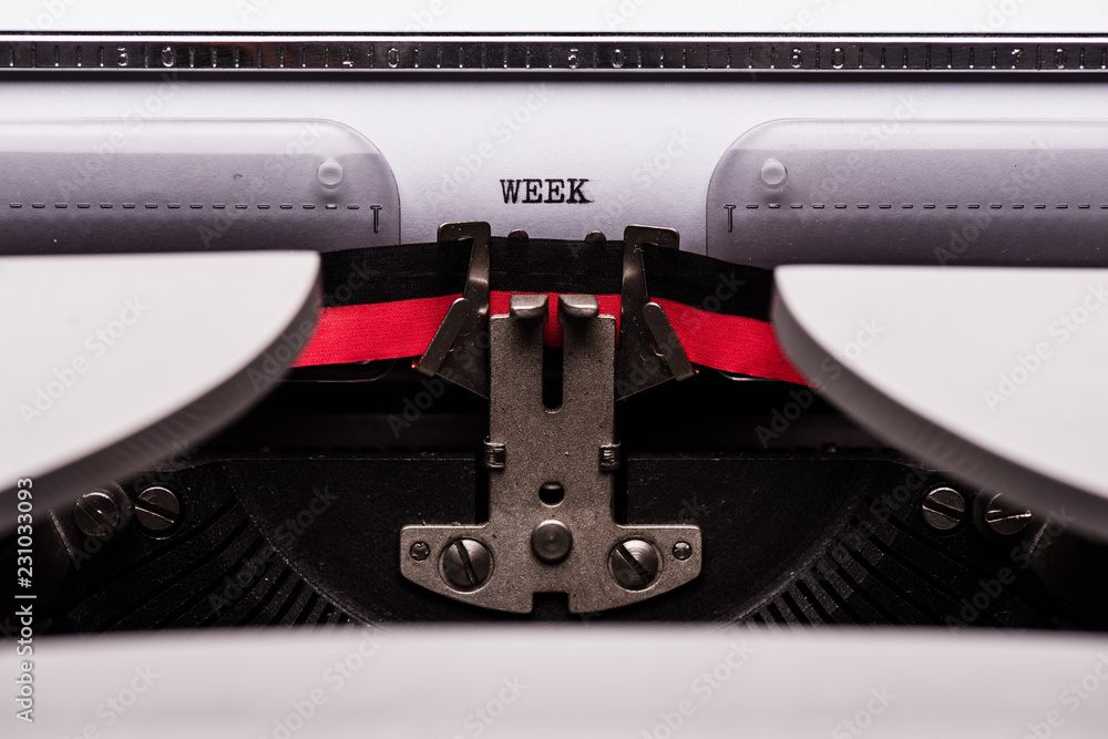 Fototapete week text on retro typewriter