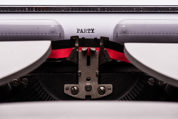 Party text on retro typewriter