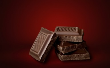 Delicious chocolates on background