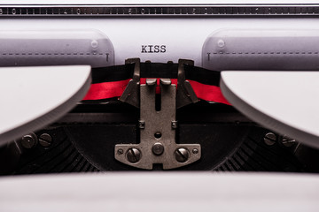 Kiss text on retro typewriter