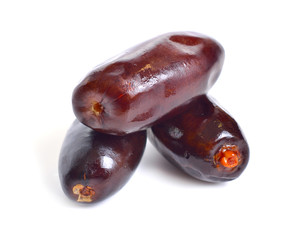 Some raw Dates isolated on white background.