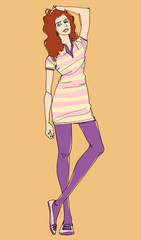 Young woman standing with hand in hair, studio shot