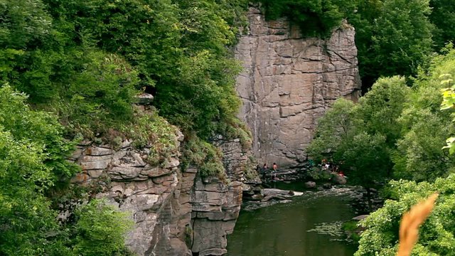 climbers to conquer the rock above the river, rock above the river, alpinists before climbing, climbers in buky canyon, climbing in a gorge above the river, ukraine buki canyon