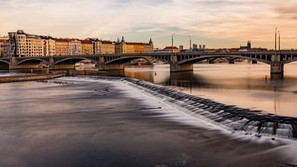 Obraz premium View from the river to Jirasek Bridge and the Vltava River. A sunny day at the Vltava river in Prague