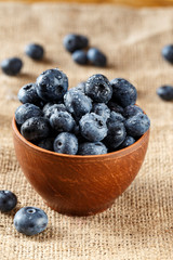 blueberries in a plate on sackcloth