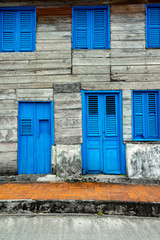Fototapeta na wymiar Wooden retro blue door and widows