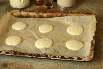 cupcakes cake from cottage cheese or cheese cakes (dough in the form). Top view