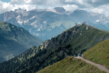 Mother and child walking in beautiful scenery of the Italian Dolomites