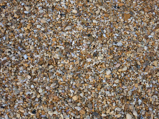 Colourful stones at the seashore. Stone backdrop, close-up photo