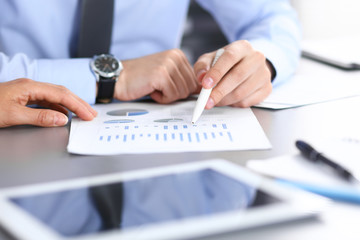 Group of business people working as a team at meeting. close-up. Colleagues or partners  discussing financial results. Successful negotiation concept