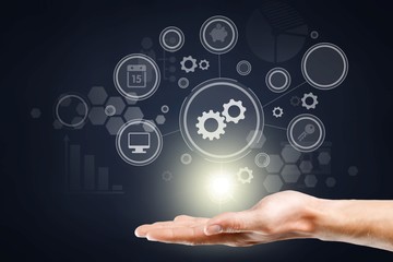 Man holding business elements icons on screen