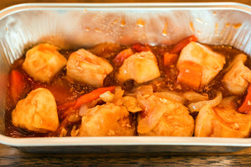 Sweet and sour chicken in bowl close