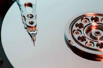 Disassembled hard drive from the computer, hdd with mirror effect. Opened hard drive from the...