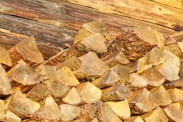 Firewood, dry chopped logs. Background. 