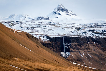 Snowy Mountain Peak with Waterfall in Snaefellsnes Iceland